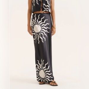 Chic Black Maxi Skirt with White Sunburst Design
